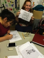 Volunteers Shannon and Michaela designing fire drawings.jpg